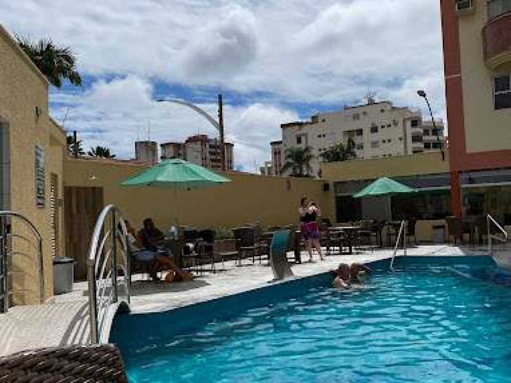 Condomínio encantador com piscinas, area de lazer.