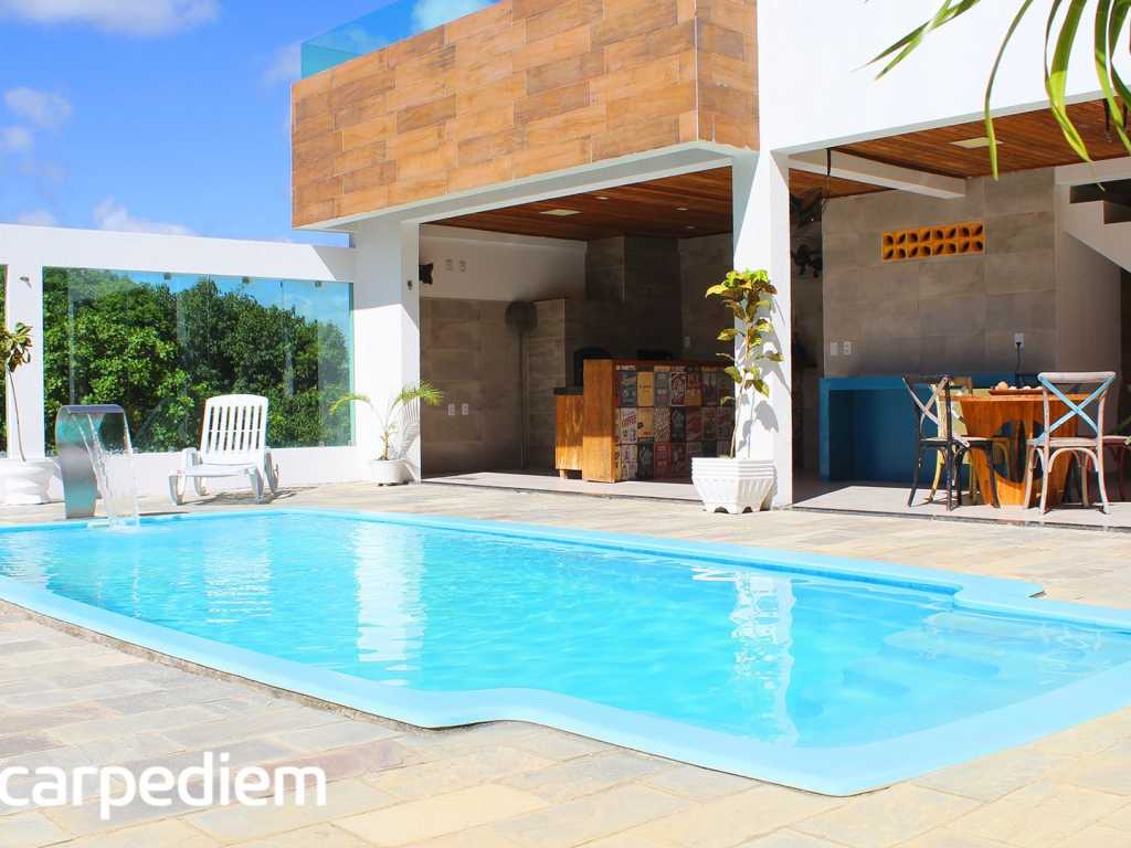 Casa com piscina privativa e poucos passos do mar em Cotovelo por Carpediem