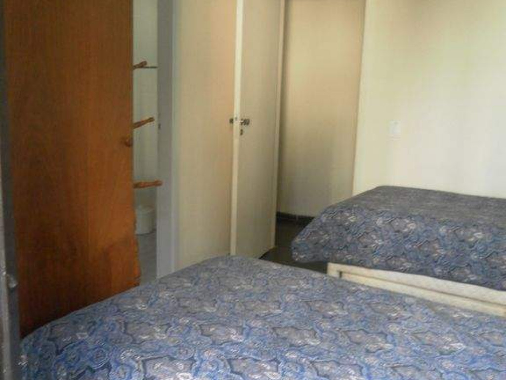 Apartamento confortável na Praia de Astúrias 3 dormitórios para até 8 pessoas