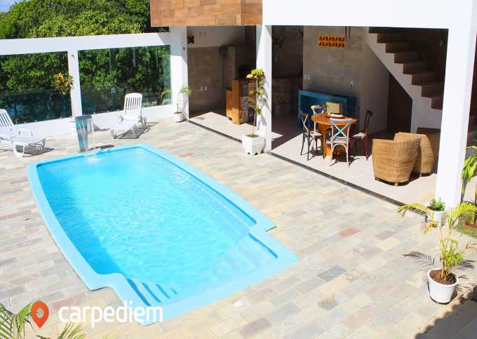 Casa com piscina privativa e poucos passos do mar em Cotovelo por Carpediem